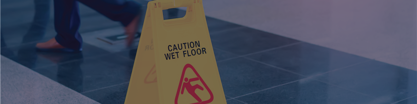 Yellow caution wet floor sign in public area